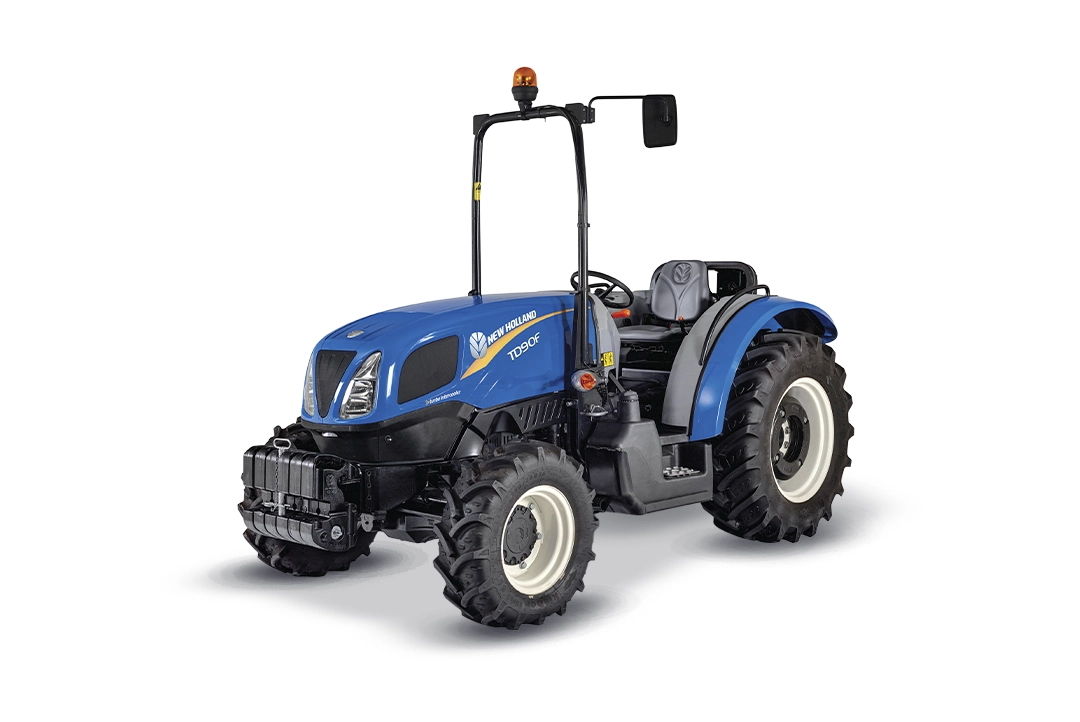 Tractor agrícola New Holland TD90F con arco de seguridad ROPS sobre fondo blanco.